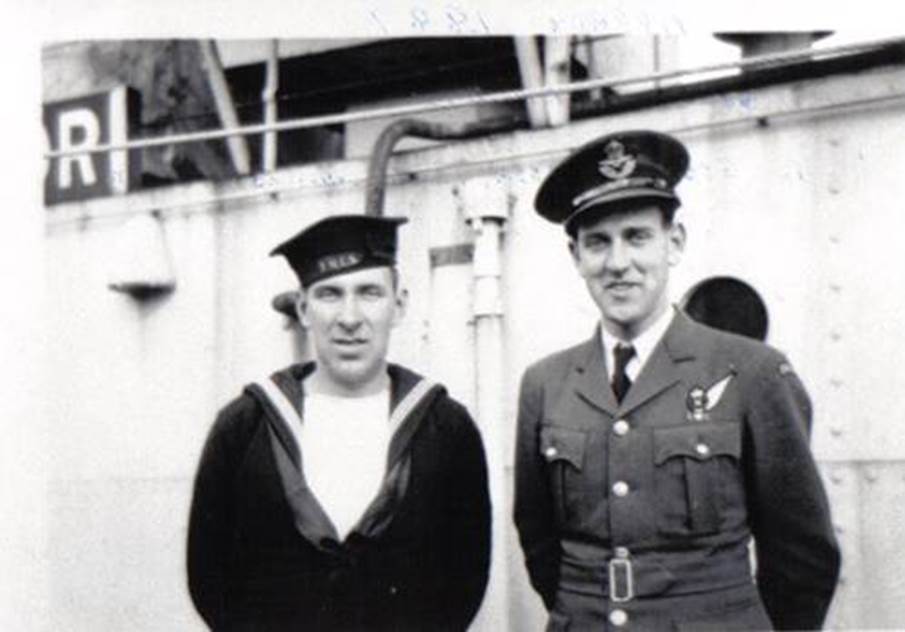 A couple of men in military uniforms
Description automatically generated